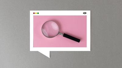 magnifying glass on pink and grey background