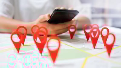 map with location points cell phone in hand