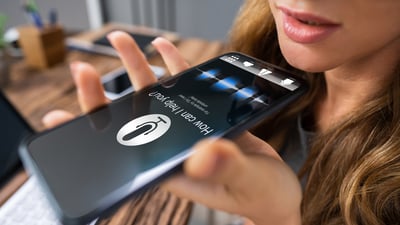 woman using voice search technology on a cell phone