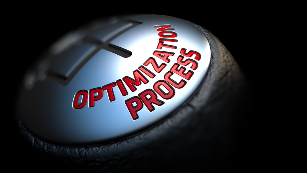 Optimization Process. Gear Shift with Red Text on Black Background. Selective Focus. 3D Render.