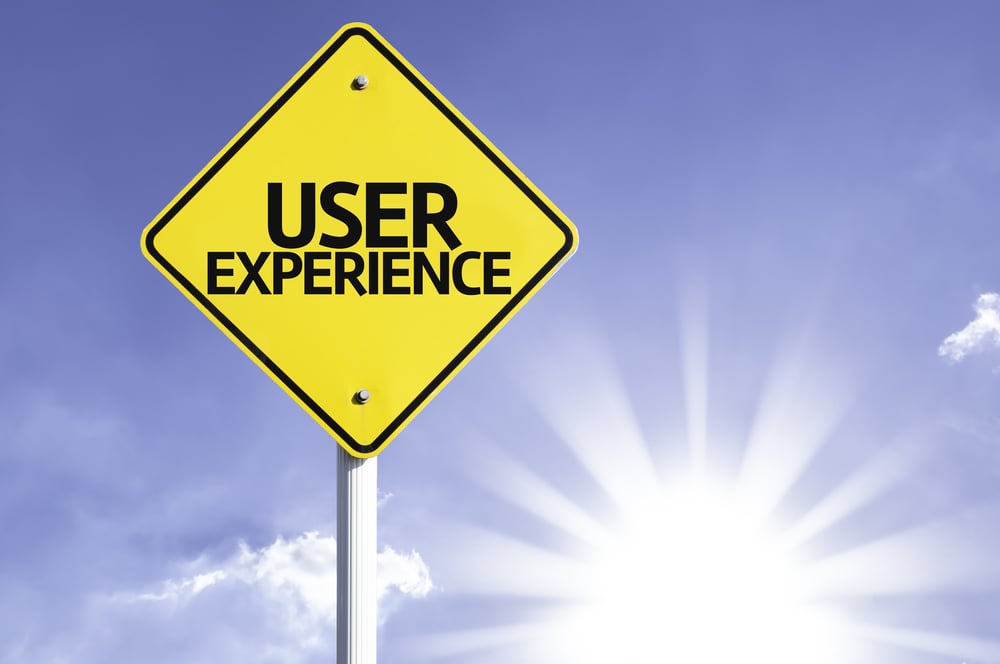 User Experience road sign with sun background