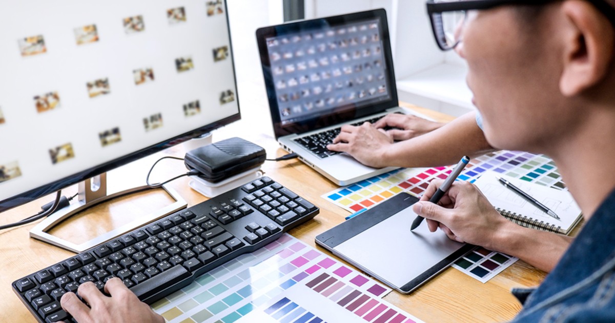 Colleagues typing on computer keyboards.