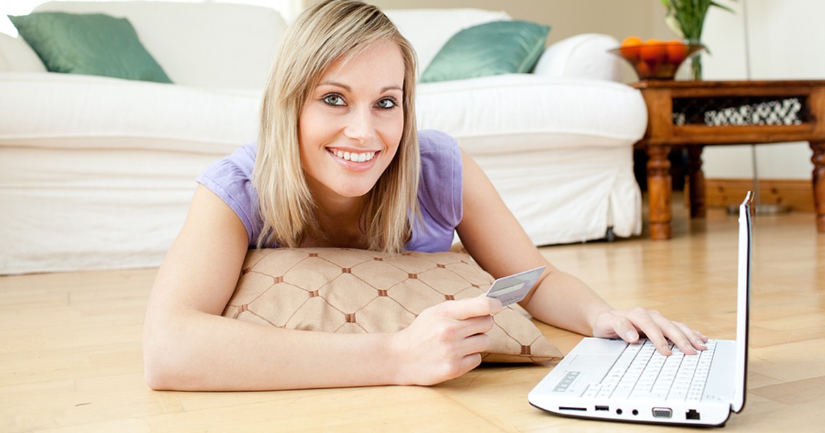 Woman making an online purchase with a credit card.