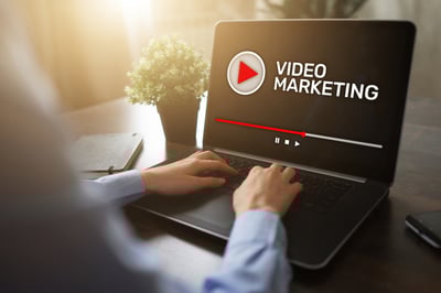 Laptop computer with the words Video Marketing displayed.