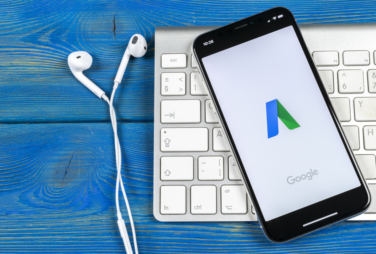 Mobile phone with the google home page on display.