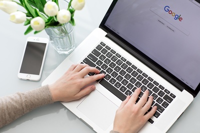 Person typing on a laptop.