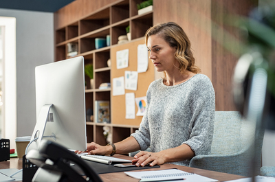 Woman working at her desk.