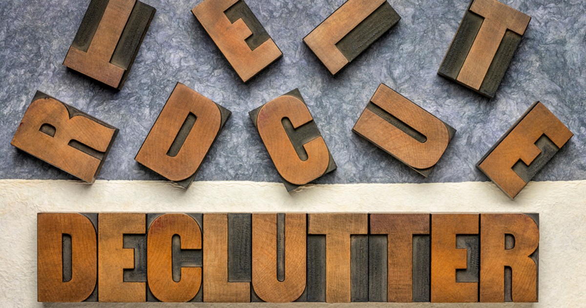 The word Declutter spelled out with wooden letters.