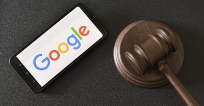 Google Logo Displayed on a mobile phone and a gavel