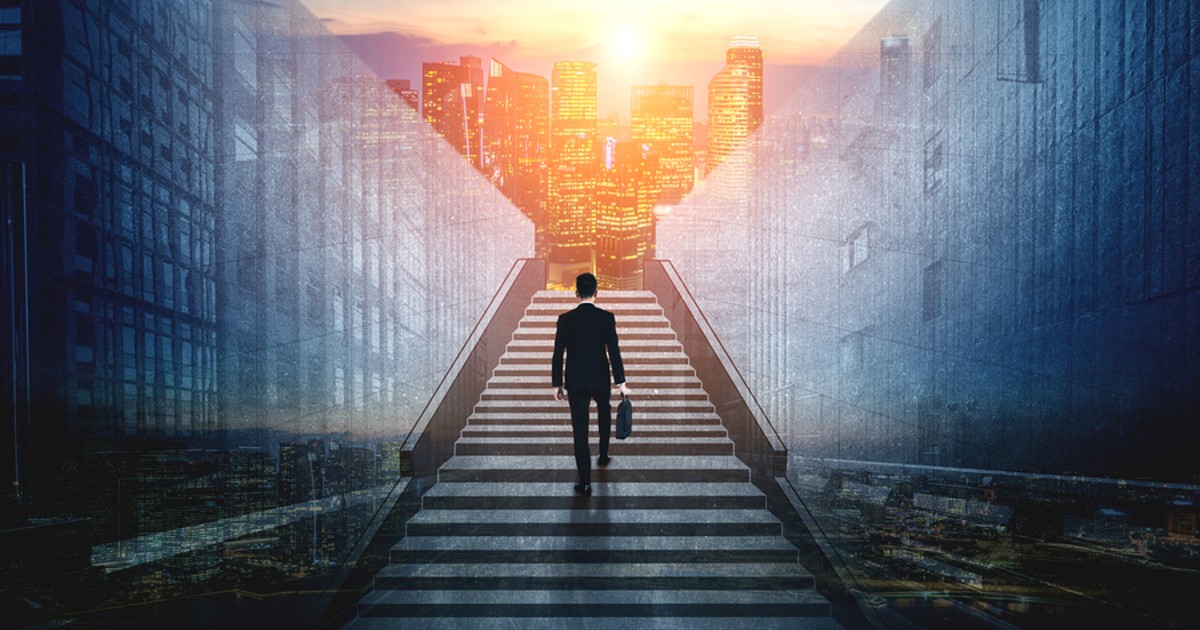 Man walking up stairs.