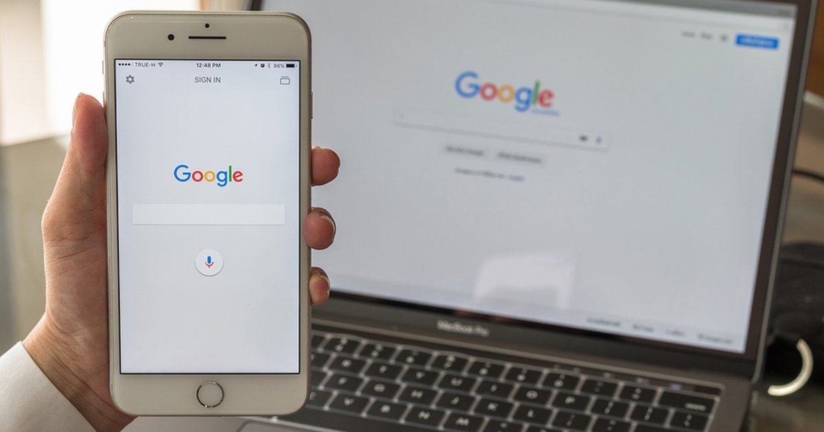 Google page displayed on a phone and laptop screen.