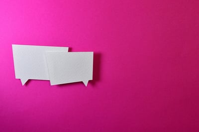 conversation bubbles on pink background