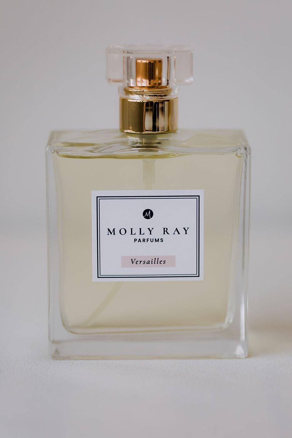Molly Ray Parfums bottle photographed on a seamless white backdrop
